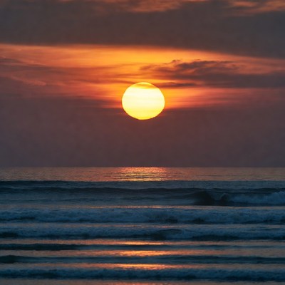 Sunset over ocean waves