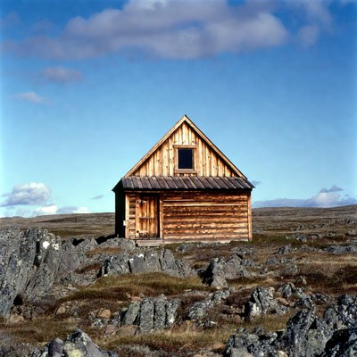 Log Cabin on Rocky Tundra