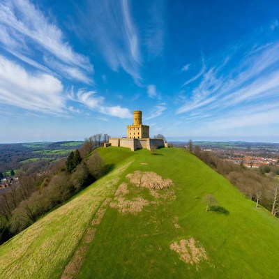 Castle atop green hill