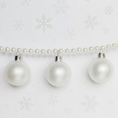 Three White Christmas Ornaments on Pearl Garland