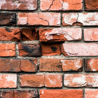 Cracked Red Brick Wall