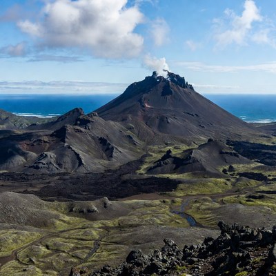 Erupting Volcano Overlooking Ocean