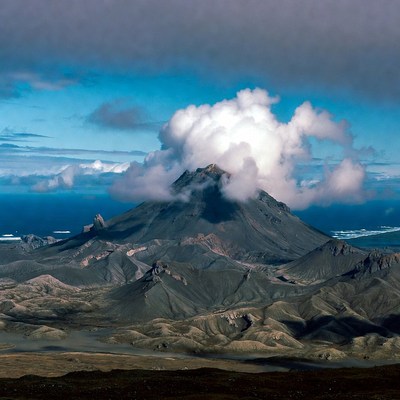 Volcano erupting with ash plume