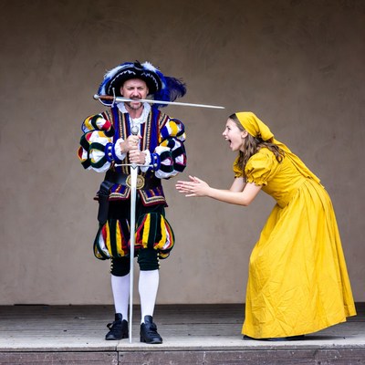 Man in Renaissance costume duels woman