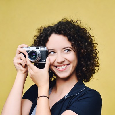 Woman holding vintage camera