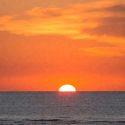 Sunset over calm ocean