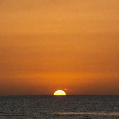 Sunset over calm ocean