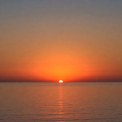Sunset over calm ocean water