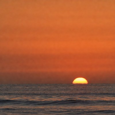 Sunset over calm ocean