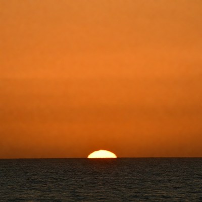 Sunset over ocean horizon