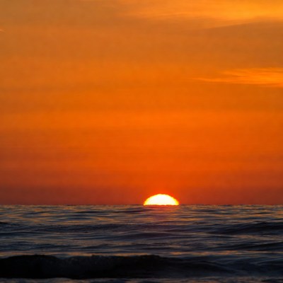 Sunset over ocean horizon