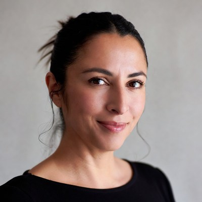 Smiling woman with bun hairstyle