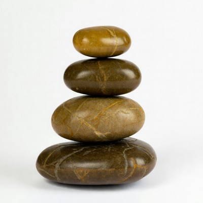 Stacked Brown Pebbles on White Background