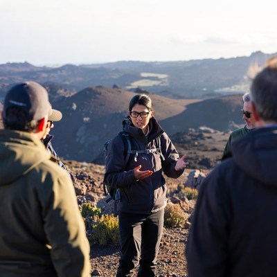 Group hikers on volcanic mountain summit