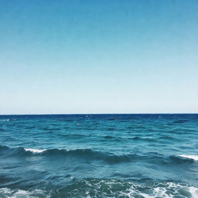 Ocean Waves Under Blue Sky