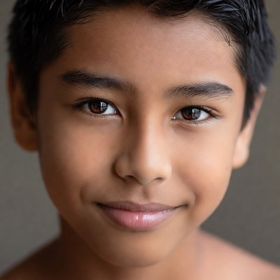 Smiling Asian boy close-up portrait