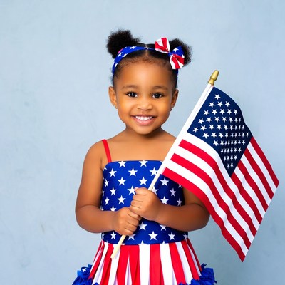 African-American girl holding American flag