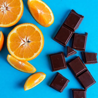 Oranges and Chocolate on Blue Background