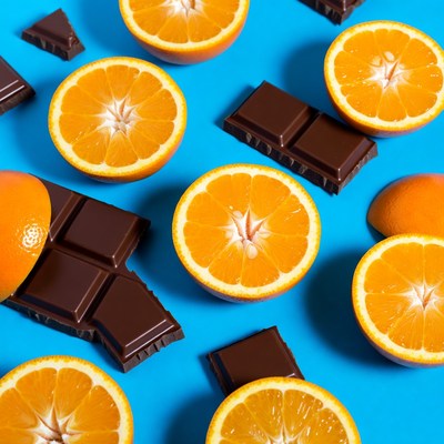 Oranges and Chocolate on Blue Background