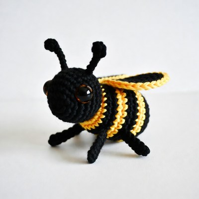 Crocheted black and yellow bee