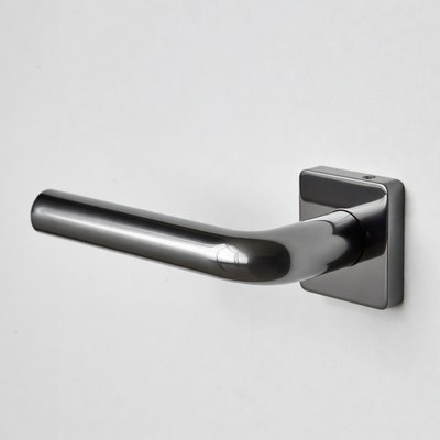 Black Door Handle on White Wall