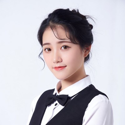 Asian woman in black bowtie uniform