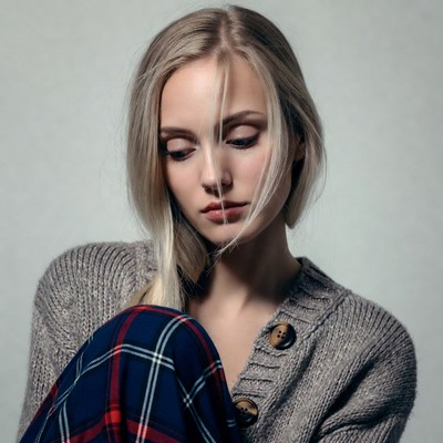Blonde woman in gray sweater