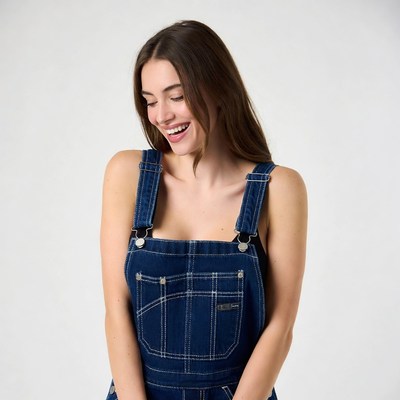 Woman smiling in blue overalls