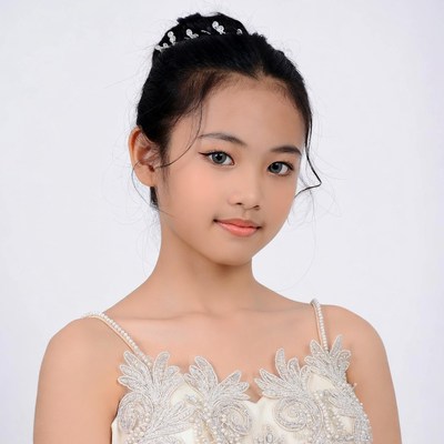 Asian girl in beaded white dress
