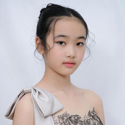 Asian girl in lace gown with bow