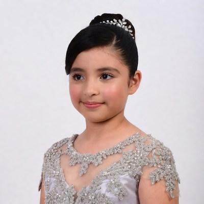 Latino girl in silver beaded dress