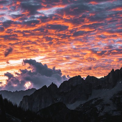 Vibrant Sunset Over Jagged Mountains