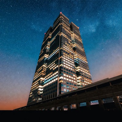 Skyscraper under starry night sky