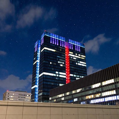 Skyscraper Illuminated in Blue and Red Lights