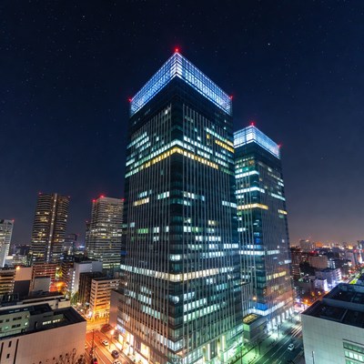Illuminated Twin Skyscrapers Night Cityscape