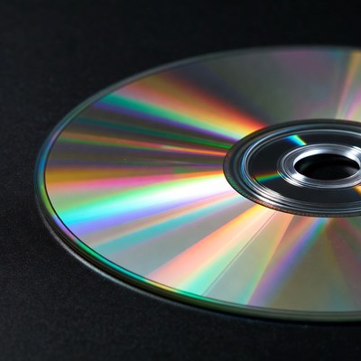 Shiny CD Disc on Black Background