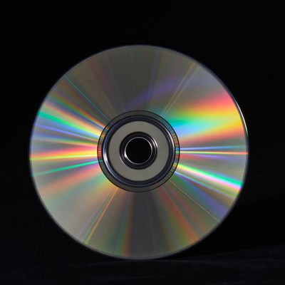 Shiny CD Disc on Black Background