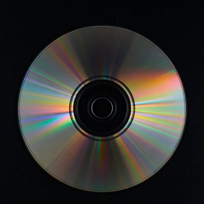 Shiny CD Disc on Black Background