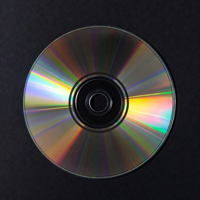 Shiny CD Disc on Black Background