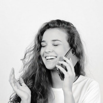Young woman laughing on phone call