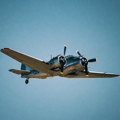 Twin-Engine Propeller Airplane Flying