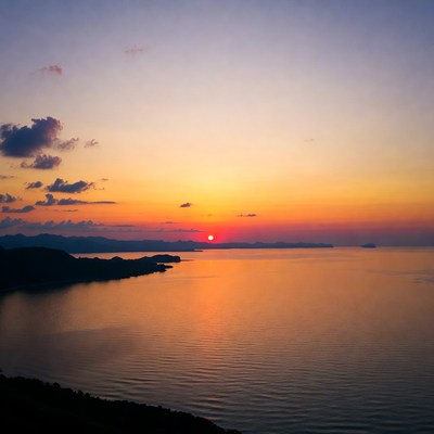 Sunset over ocean and mountains