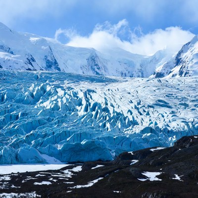 Massive glacier in snowy mountains