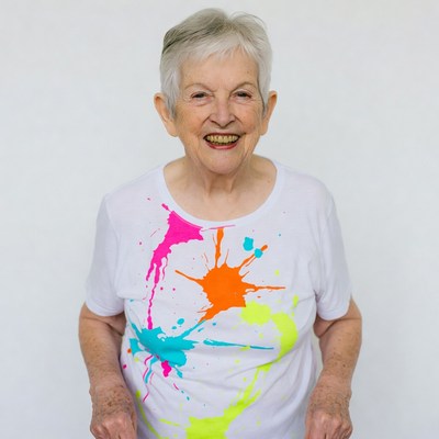 Elderly woman in colorful splatter t-shirt