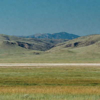 Vast Green Rolling Hills Landscape