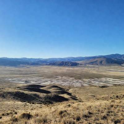 Vast Desert Valley with Mountains