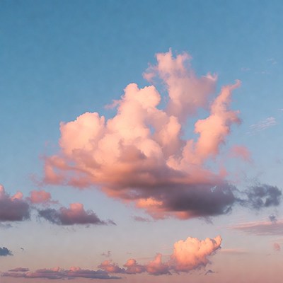 Fluffy Pink Clouds in Blue Sky