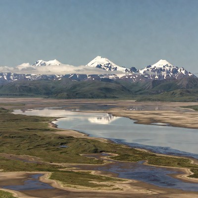 Snowy Mountains Over River Valley