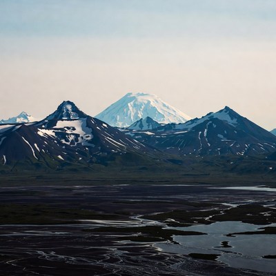 Snowy Volcanic Mountains and Valley