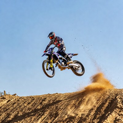 Motocross rider jumping dirt bike